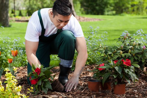 Edmonton garden care team planting flowers and refreshing landscape beds
